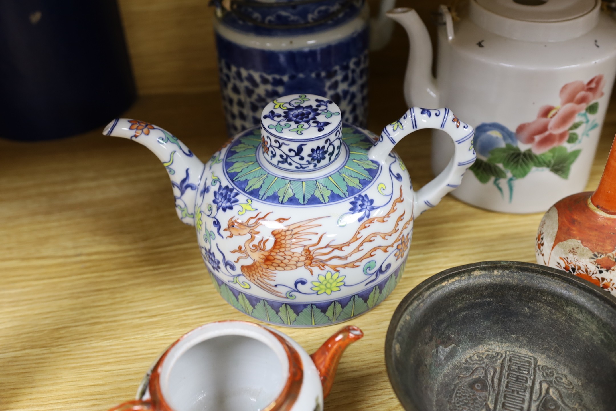 A Chinese bronze bowl, with inscriptions, possibly 18th century, 13.5cm diameter, two pieces of Japanese Kutani, a small Imari vase and three Chinese tea pots
